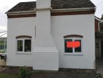 Floating sand/ cement over painted brick and plinth