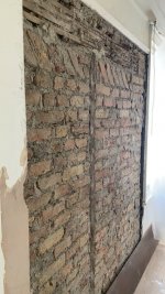 Damp patch on newly plastered wall