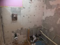 Plastering over old tile adhesive in bathroom