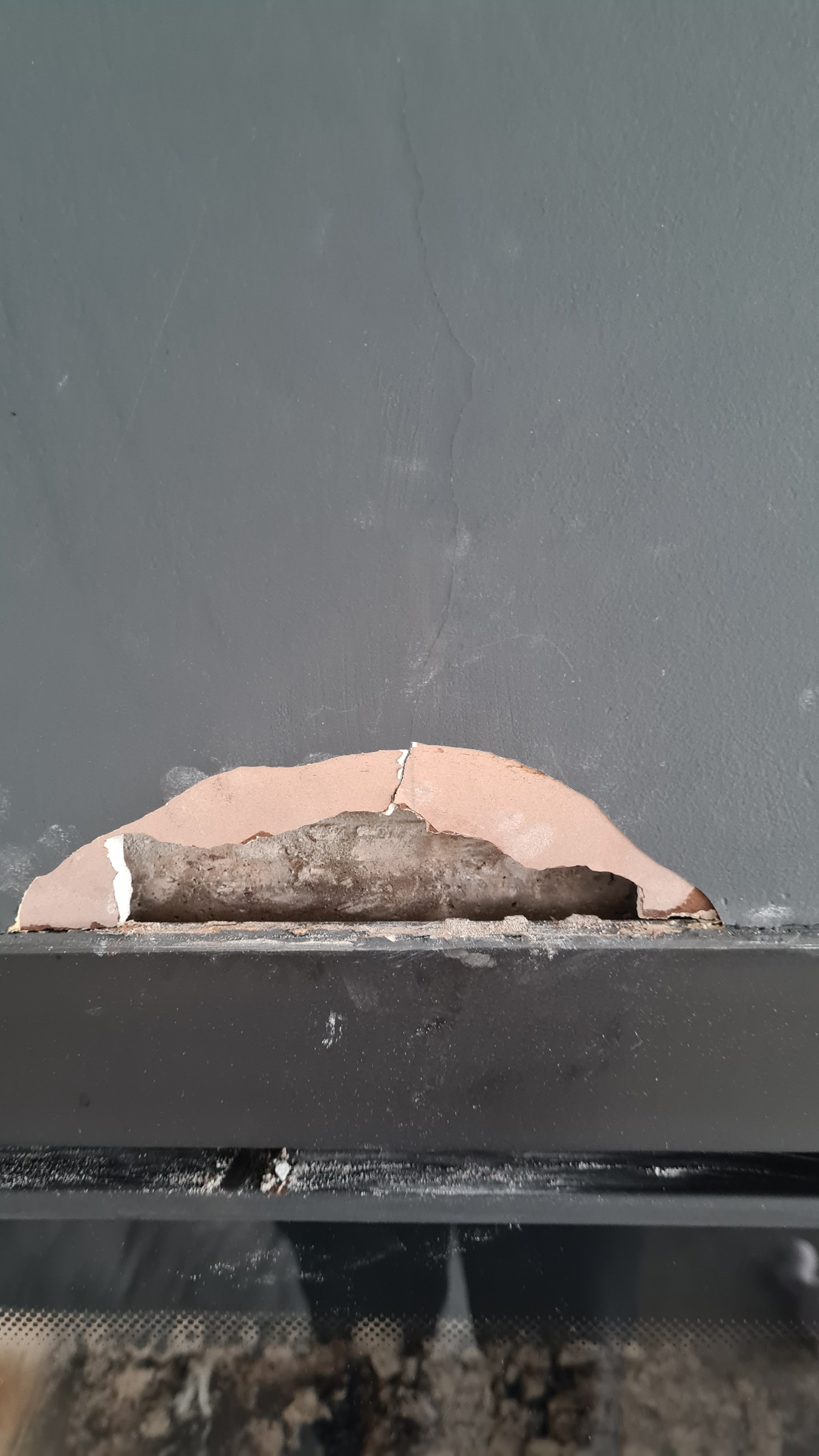 Inset stove plaster peeling and cracked plasterboard