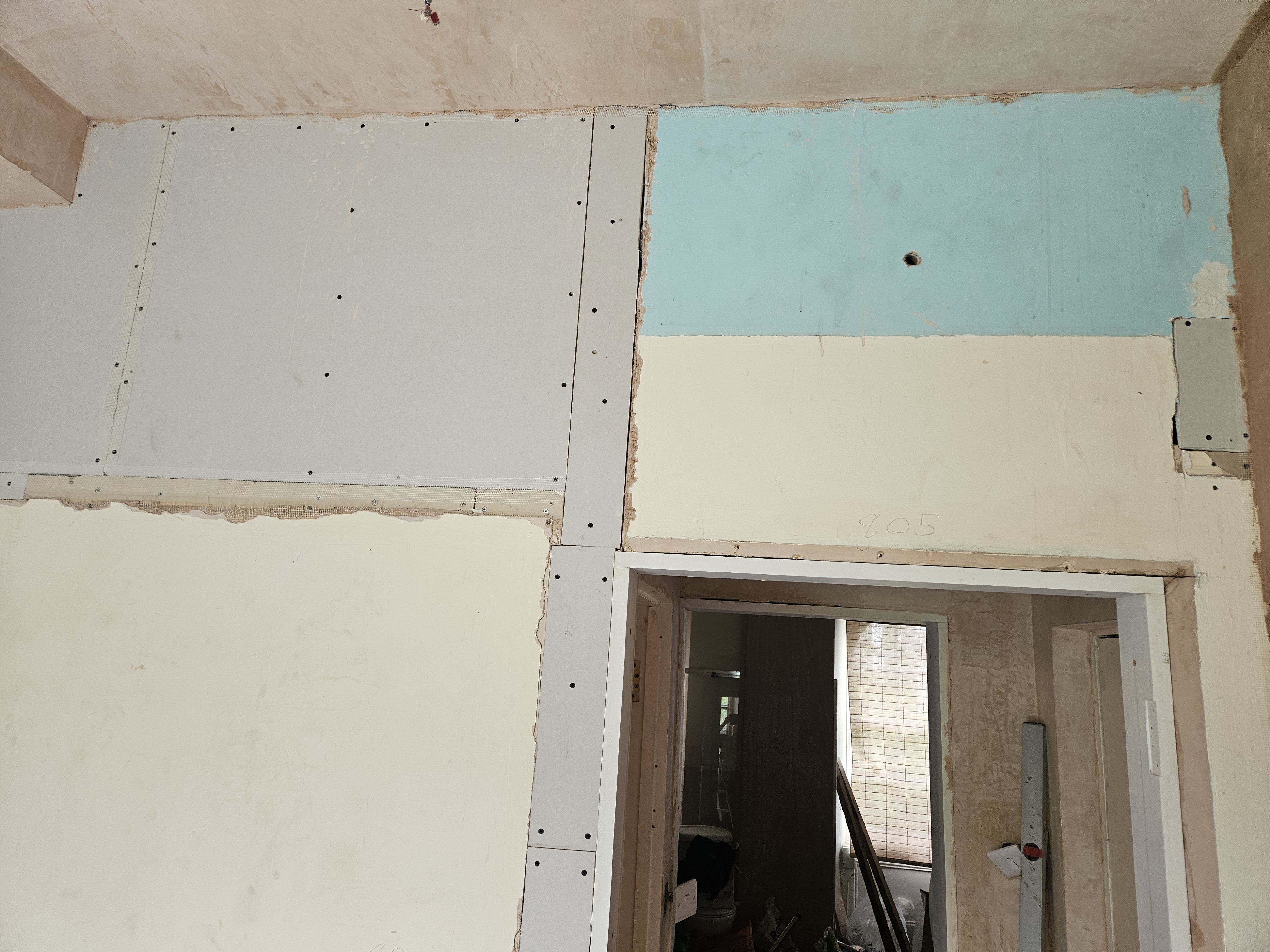 Old plaster against new plasterboard