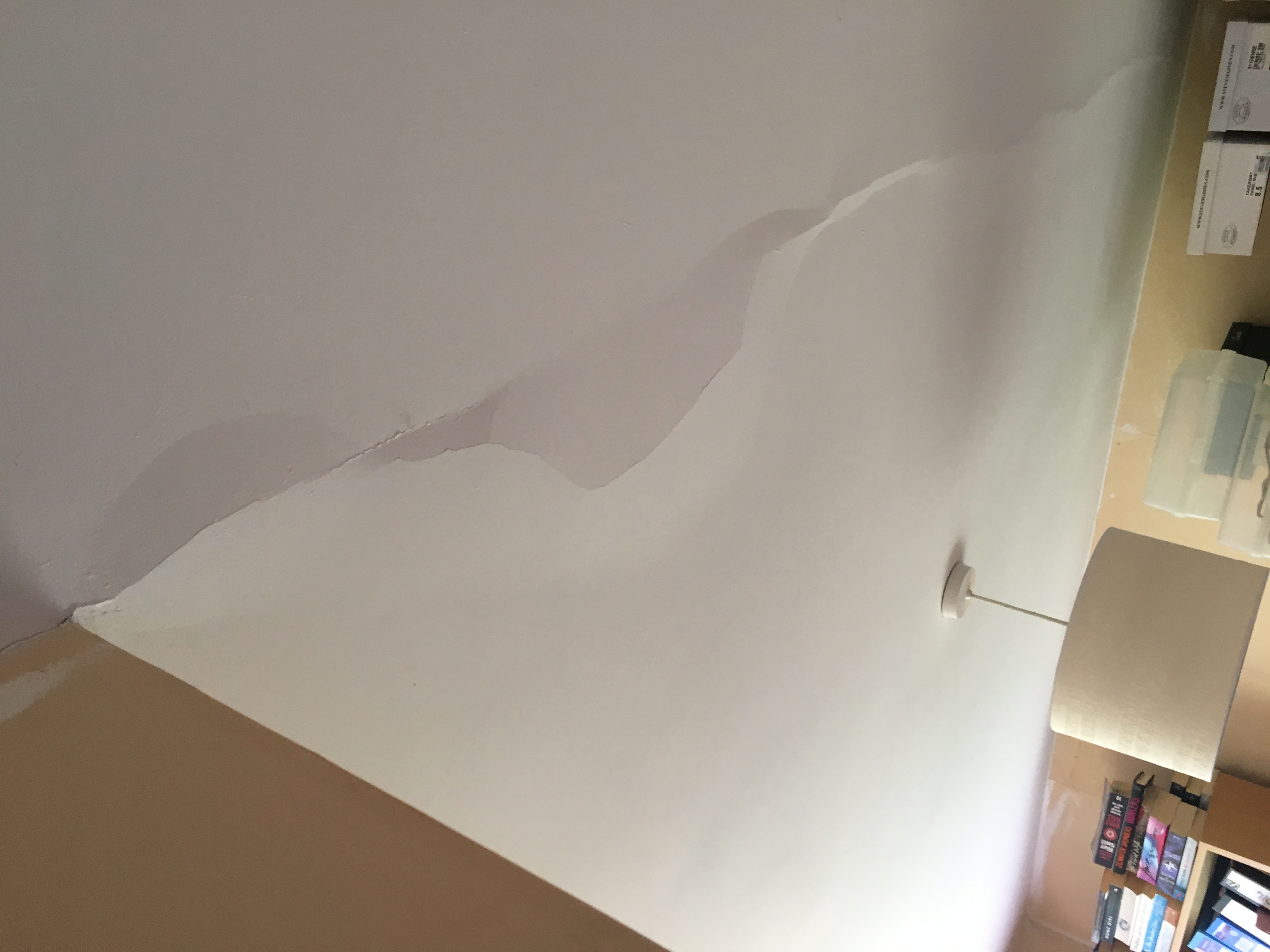 Lines of plaster coming away from ceiling