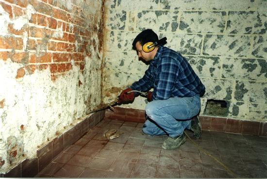 contractor working on damp proof course.jpg