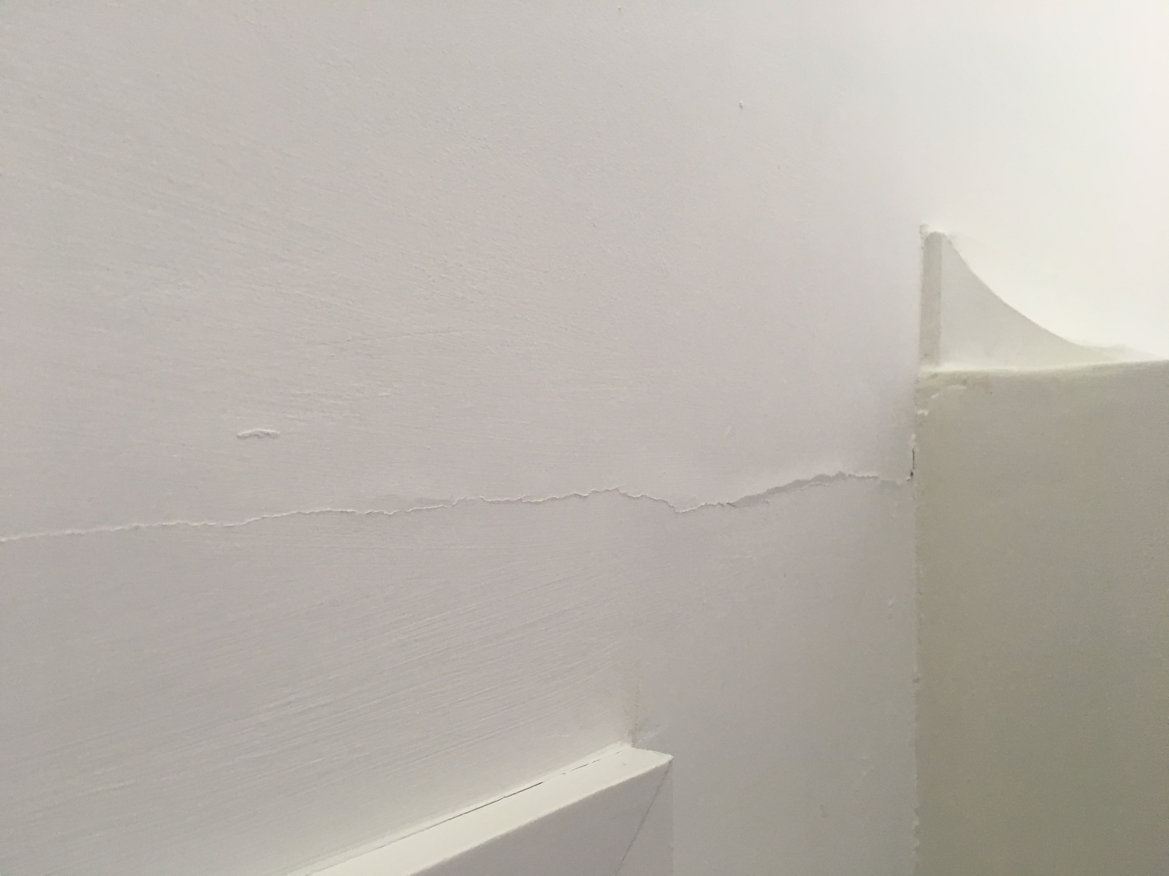 Lines of plaster coming away from ceiling