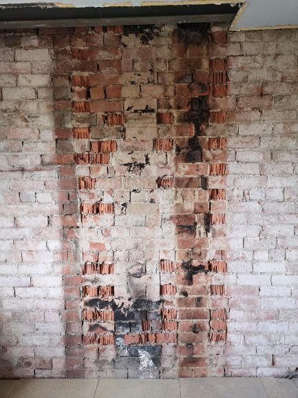 dot and dab over soot on bricks