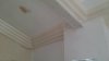 Art deco cornice and a sloped ceiling