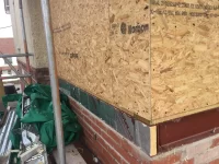 Render timber frame on brick extension.