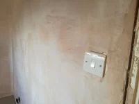 Should plasterer have removed socket/switch covers?