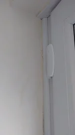 Penetrating damp / stain on joining wall just below porch roof