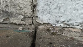 Penetrating damp / stain on joining wall just below porch roof