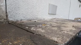 Penetrating damp / stain on joining wall just below porch roof