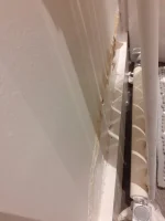 Dry Damp patches on both sides of internal wall