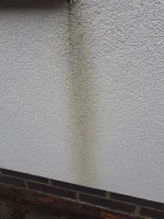 Stain on newly rendered wall