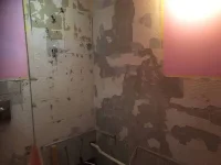 Plastering over old tile adhesive in bathroom