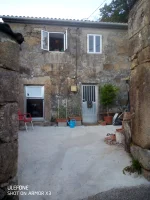 DIY in Galicia, Northern Spain. Smooth finish a rough stone wall but keep the outline of the stones.